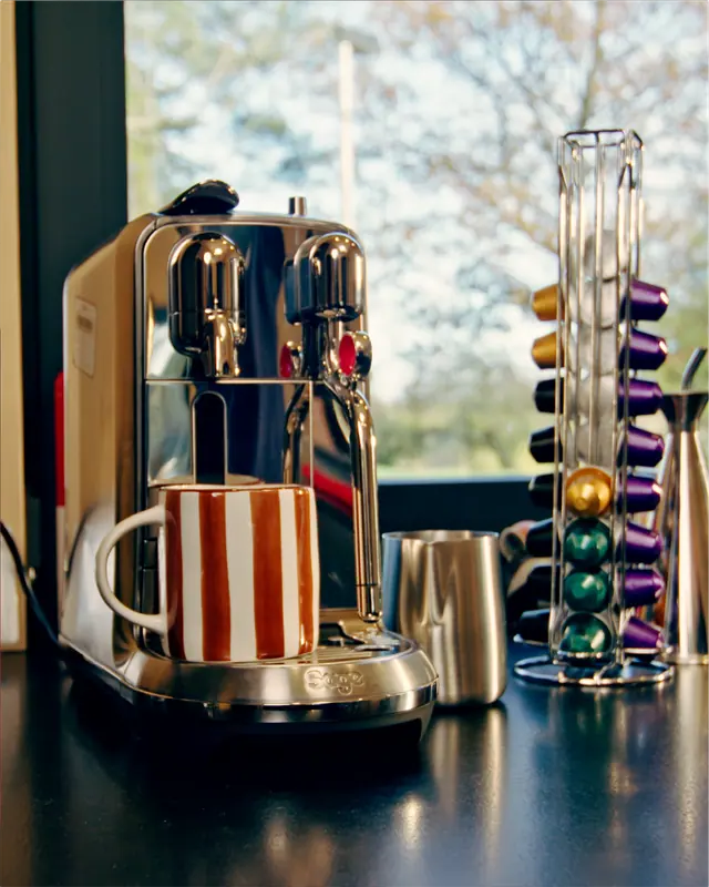 Carousel image of the coffee machine by the window
