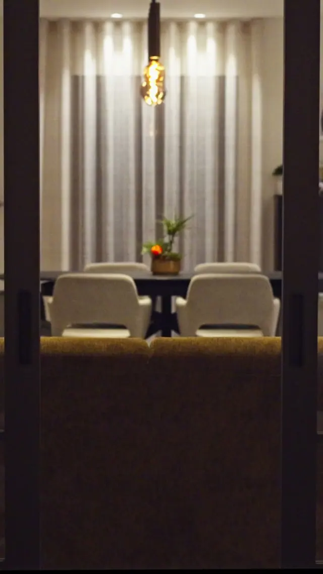 A dining room with a pendant lamp, from an SN Group reel